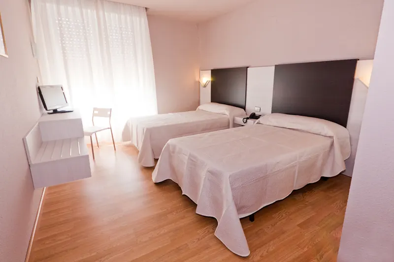 Habitación triple con tres camas